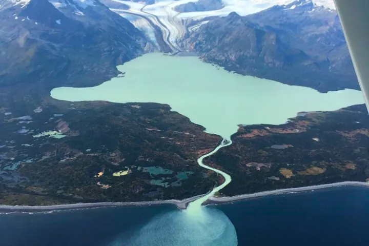a view of a body of water with a mountain in the background