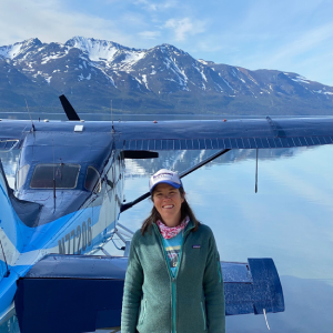 a person standing in front of a plane