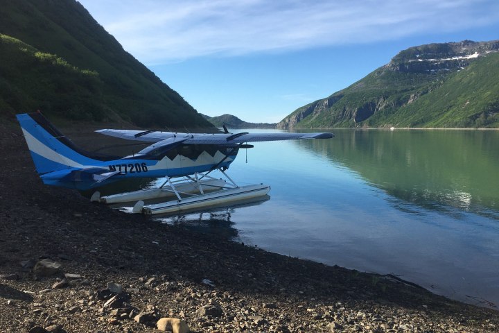a body of water with a mountain in the background