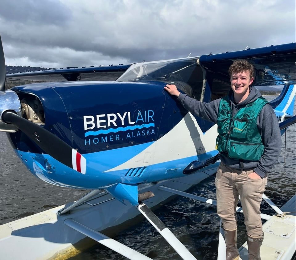 a man standing in front of a plane